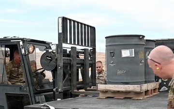 377th Maintenance Squadron Airmen load brass casings onto tractor
