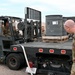 377th Maintenance Squadron Airmen load brass casings onto tractor