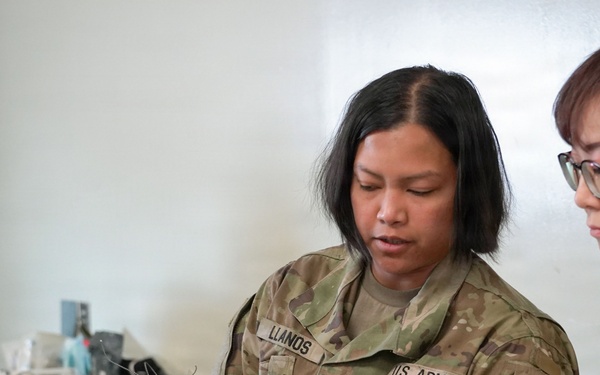 Medics review patient information during exercise