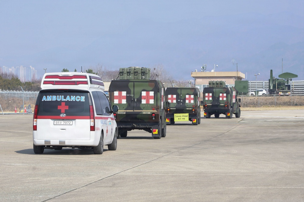 Medical convoy departs airfield during training scenario