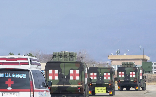 Medical convoy departs airfield during training scenario