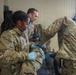 Medical personnel treat simulated casualty