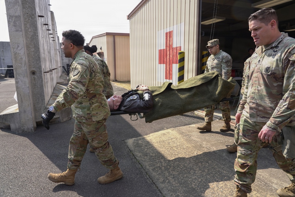 Soldiers move casualty to evacuation point