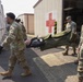 Soldiers move casualty to evacuation point