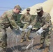 Soldiers construct defensive barrier during logistics training