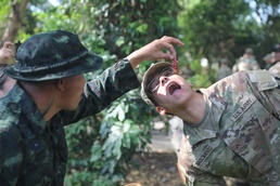 US Soldiers learn jungle survival from RTA Special Warfare Instructor