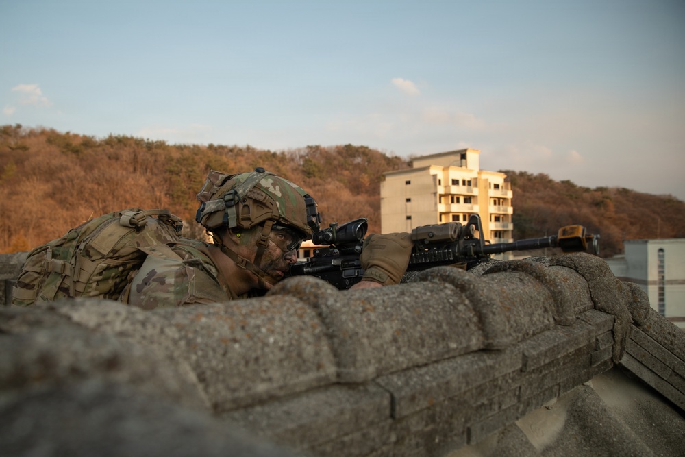 Soldier pulls security on rooftop