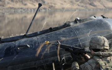 Soldier pulls security next to a Zodiac