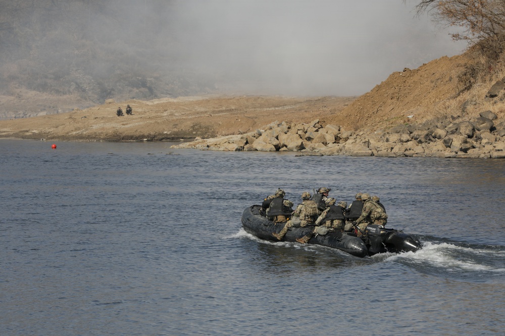 Soldiers utilize a Zodiac boat