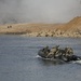Soldiers utilize a Zodiac boat