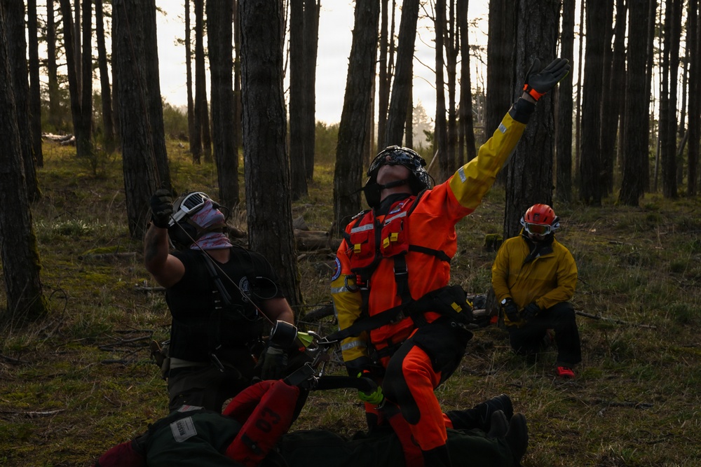 U.S. Coast Guard helicopter aircrews train as part of the Advanced Helicopter Rescue School at the Camp Rilea Armed Forces Training Center in Oregon.