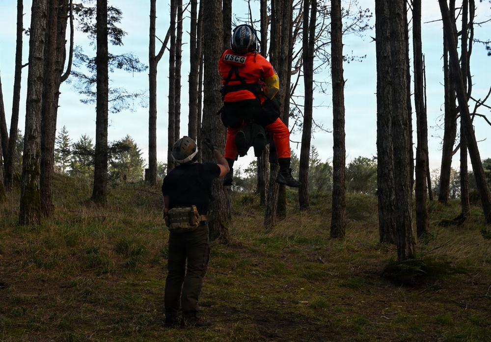 U.S. Coast Guard helicopter aircrews train as part of the Advanced Helicopter Rescue School at the Camp Rilea Armed Forces Training Center in Oregon.