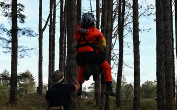 U.S. Coast Guard helicopter aircrews train as part of the Advanced Helicopter Rescue School at the Camp Rilea Armed Forces Training Center in Oregon.