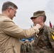 Kaimo Kuusk pins a medal on the 6-9 CAV commander