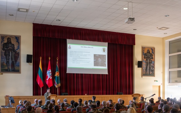 U.S. Army Capt. Jared Berken briefs Lithuanian audience on Civil Affairs and NATO CIMIC
