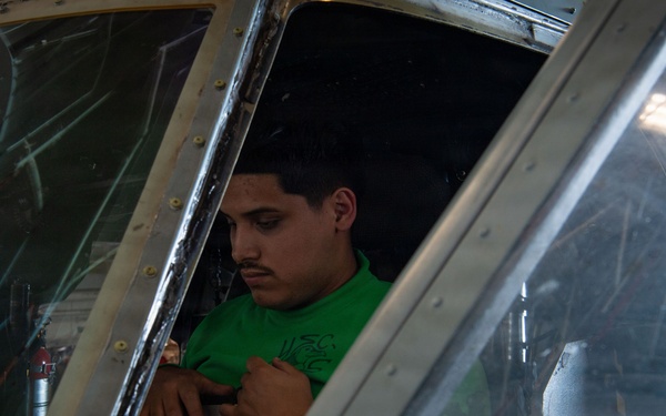 Sailor Conducts Helicopter Maintenance