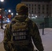 A Joint Task Force Magnolia Soldier patrols at night in Washington, D.C.