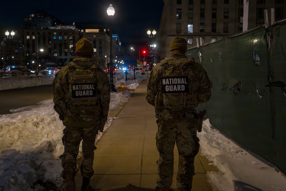 Joint Task Force Magnolia Soldiers patrol at night in Washington, D.C.