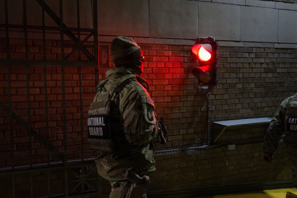 A Joint Task Force Magnolia Soldier patrols at night in Washington, D.C.