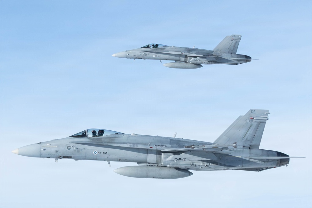 CORE26 | Air-to-air U.S. Marine Refuel Finnish F/A-18 Hornets over Arctic Circle