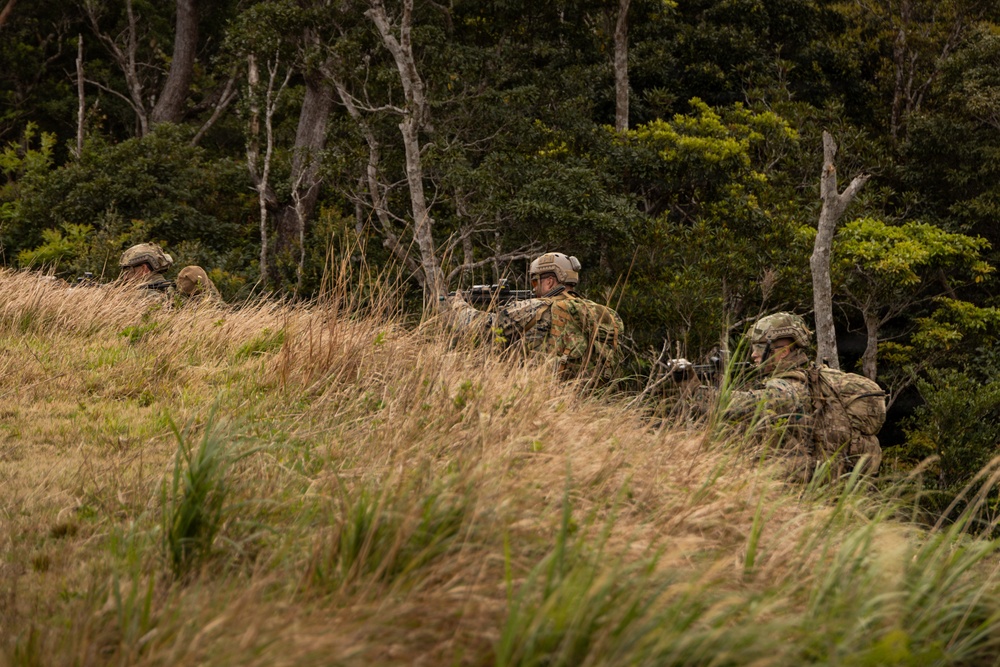 U.S. Marines with 3rd Reconnaissance Battalion conduct a covert landing in a simulated hostile environment