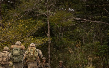 U.S. Marines with 3rd Reconnaissance Battalion conduct a covert landing in a simulated hostile environment
