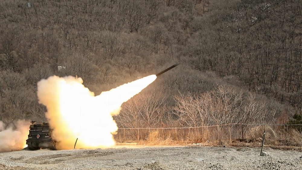 M270A1 Multi Launch Rocket System fires a rocket at Rocket Valley