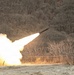 M270A1 Multi Launch Rocket System fires a rocket at Rocket Valley