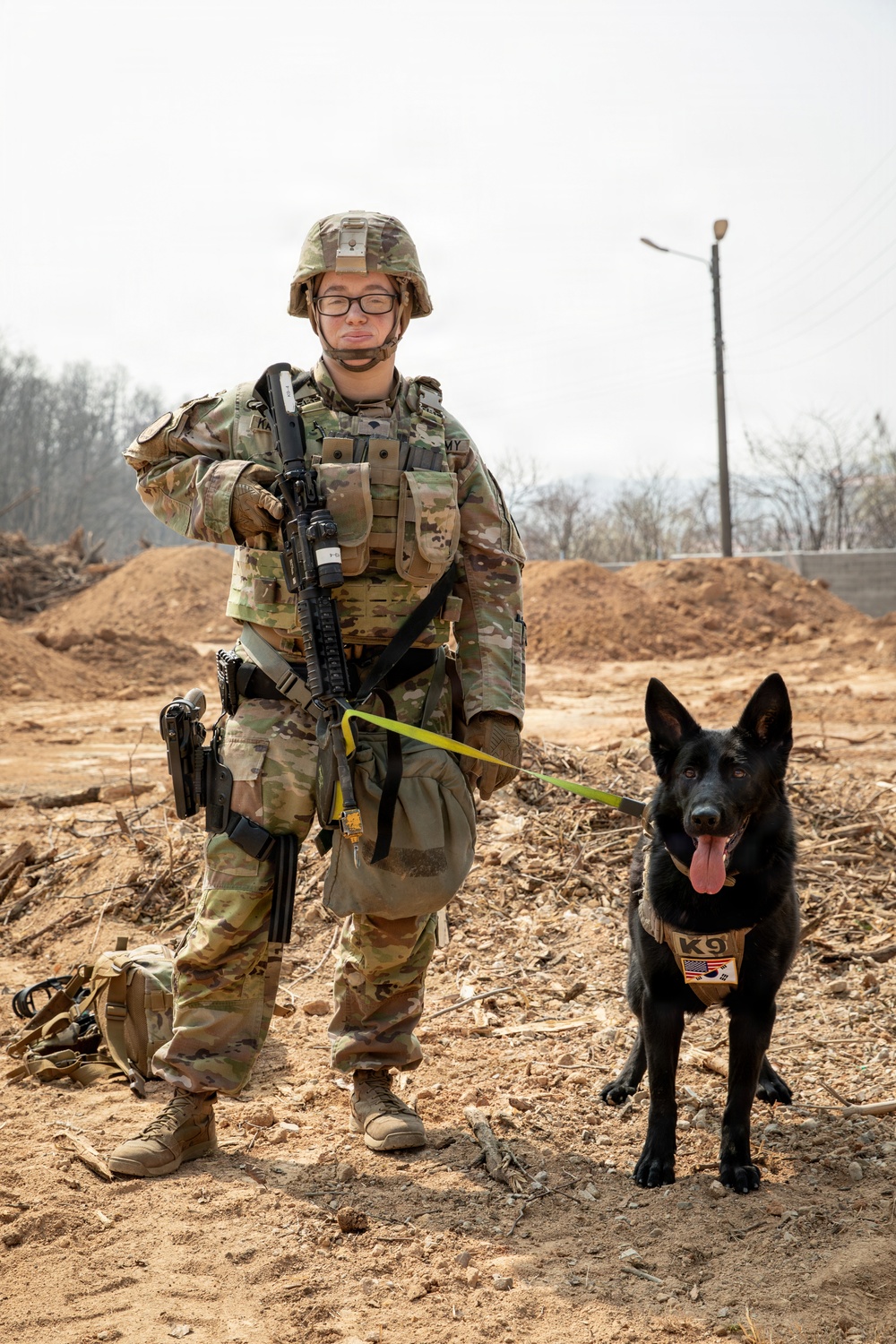 Military working dog handler team poses for photo