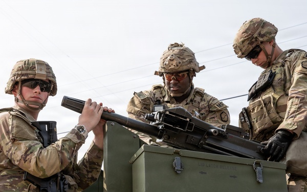 Soldiers secure MK-19 to vehicle