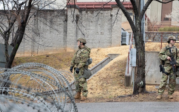 MP Soldiers wait for vehicles at entry checkpoint