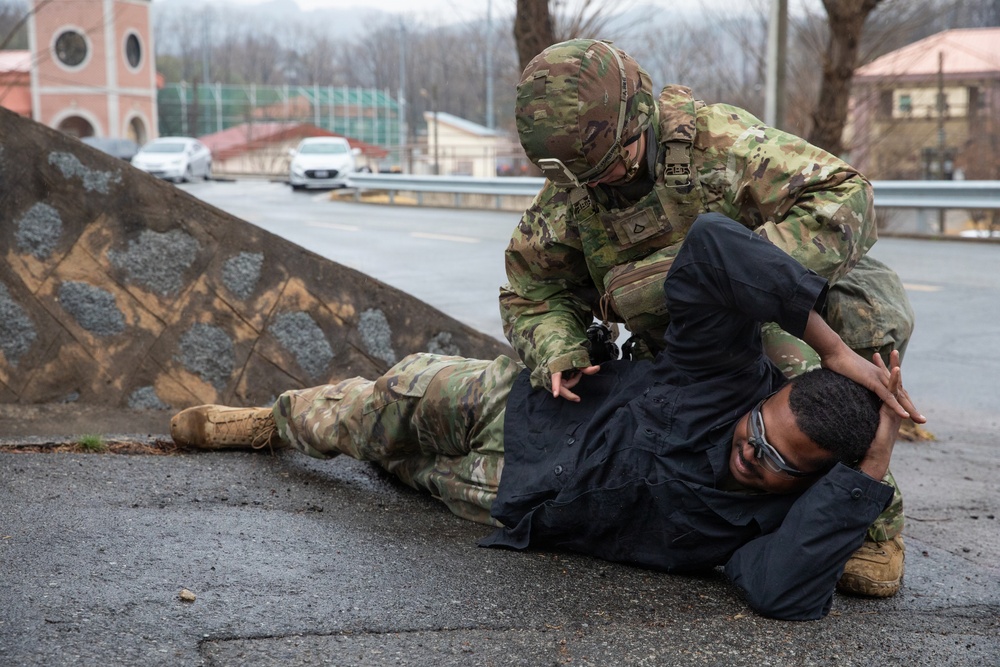 MP searches simulated detainee