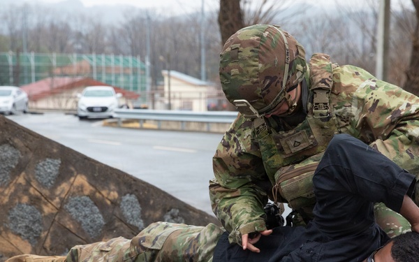 MP searches simulated detainee