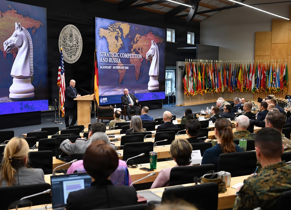 Retired Gen. Christopher Cavoli engages with participants during Strategic Competition and Russia