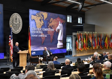 Retired Gen. Christopher Cavoli engages with participants during Strategic Competition and Russia
