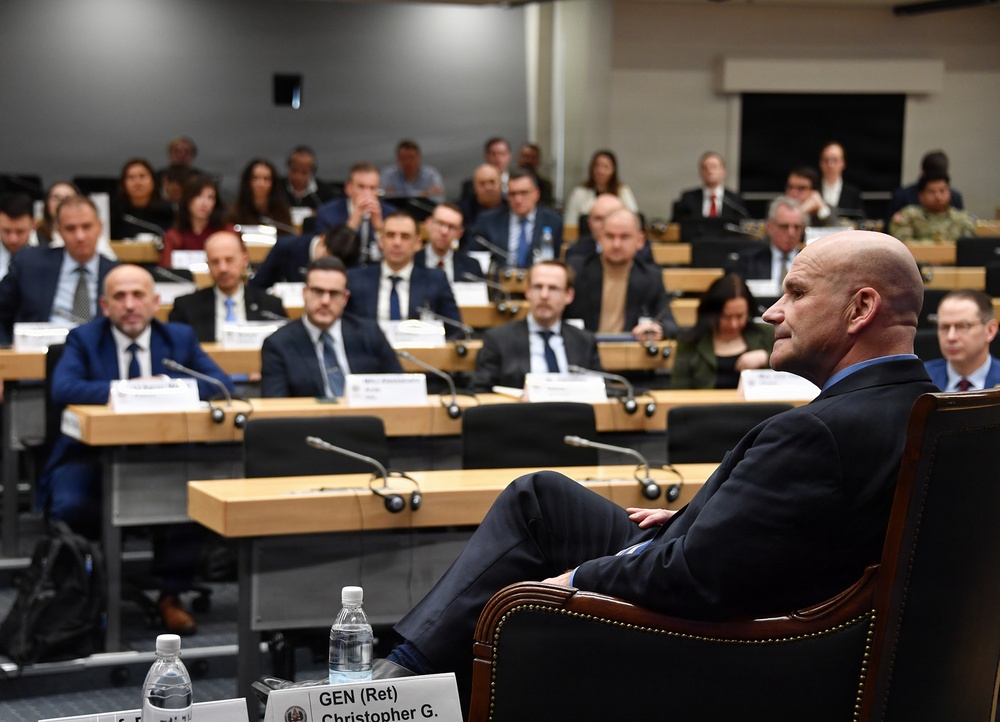 Retired Gen. Christopher Cavoli engages with participants during the Strategic Competition in Russia course