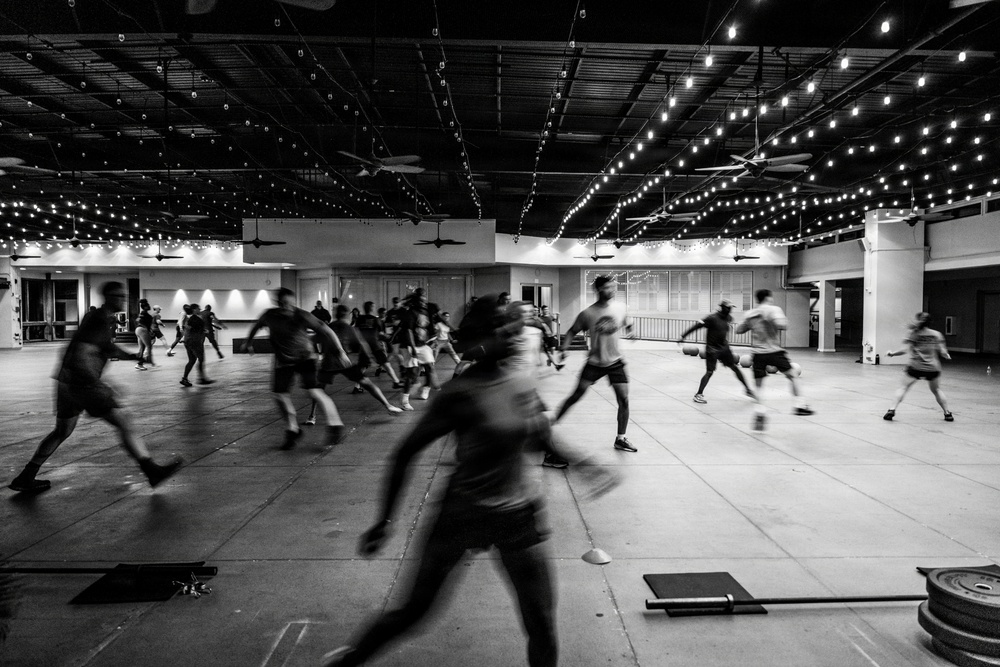 Team Hickam's 647th Security Forces Squadron and 15th Operational Support Team conduct group physical training