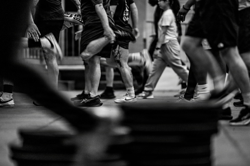 Team Hickam's 647th Security Forces Squadron and 15th Operational Support Team conduct group physical training