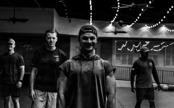 Team Hickam's 647th Security Forces Squadron and 15th Operations Support Team conduct group physical training