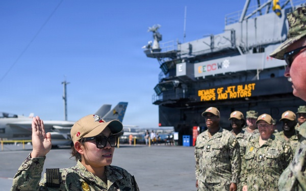 Master-at-Arms 1st Class Jovelyn Peugh reenlists aboard historic USS Midway Museum