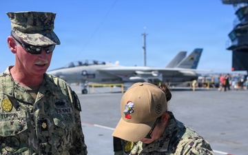Master-at-Arms 1st Class Jovelyn Peugh reenlists aboard historic USS Midway Museum