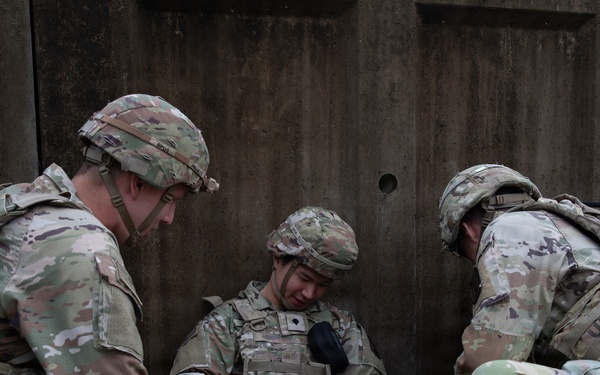 Military Intelligence Soldiers Partner with Garrison Firefighters During Simulated Mass Casualty Exercise