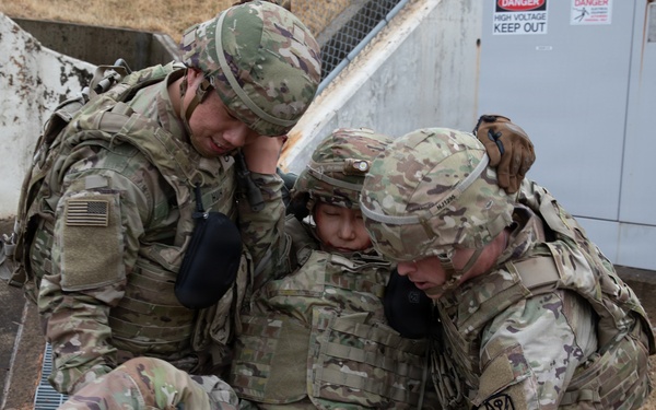 Military Intelligence Soldiers Partner with Garrison Firefighters During Simulated Mass Casualty Exercise