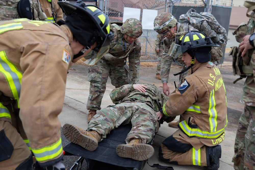 Military Intelligence Soldiers Partner with Garrison Firefighters During Simulated Mass Casualty Exercise