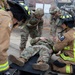 Military Intelligence Soldiers Partner with Garrison Firefighters During Simulated Mass Casualty Exercise