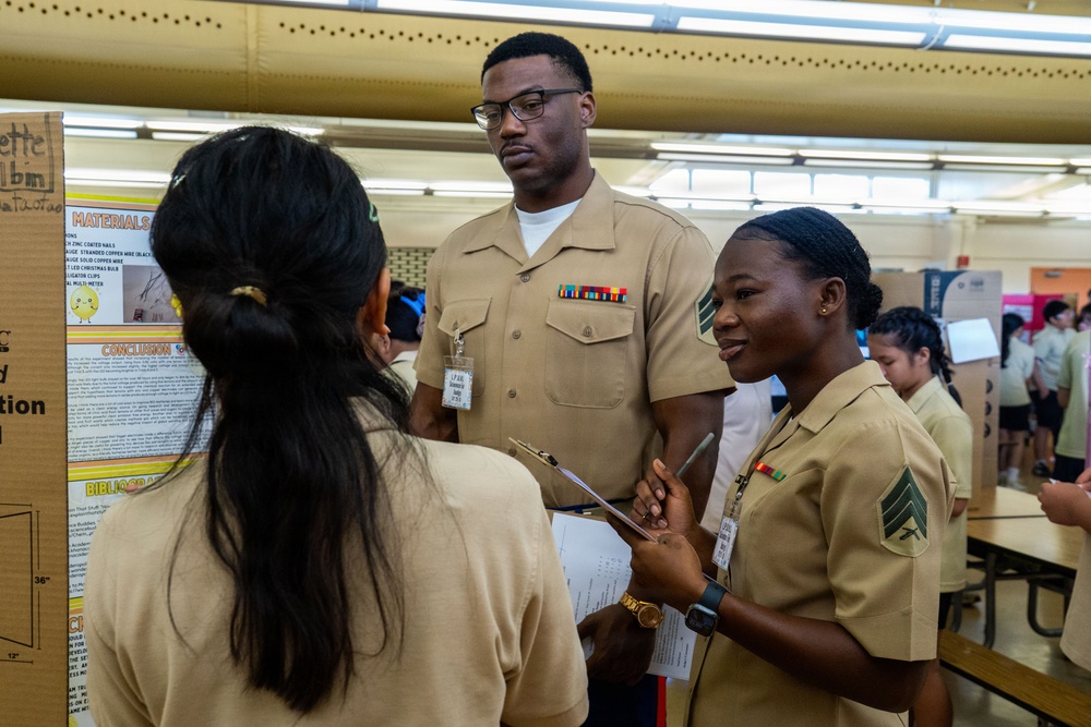 Camp Blaz Marines Judge Untalan Middle School's Science Fair