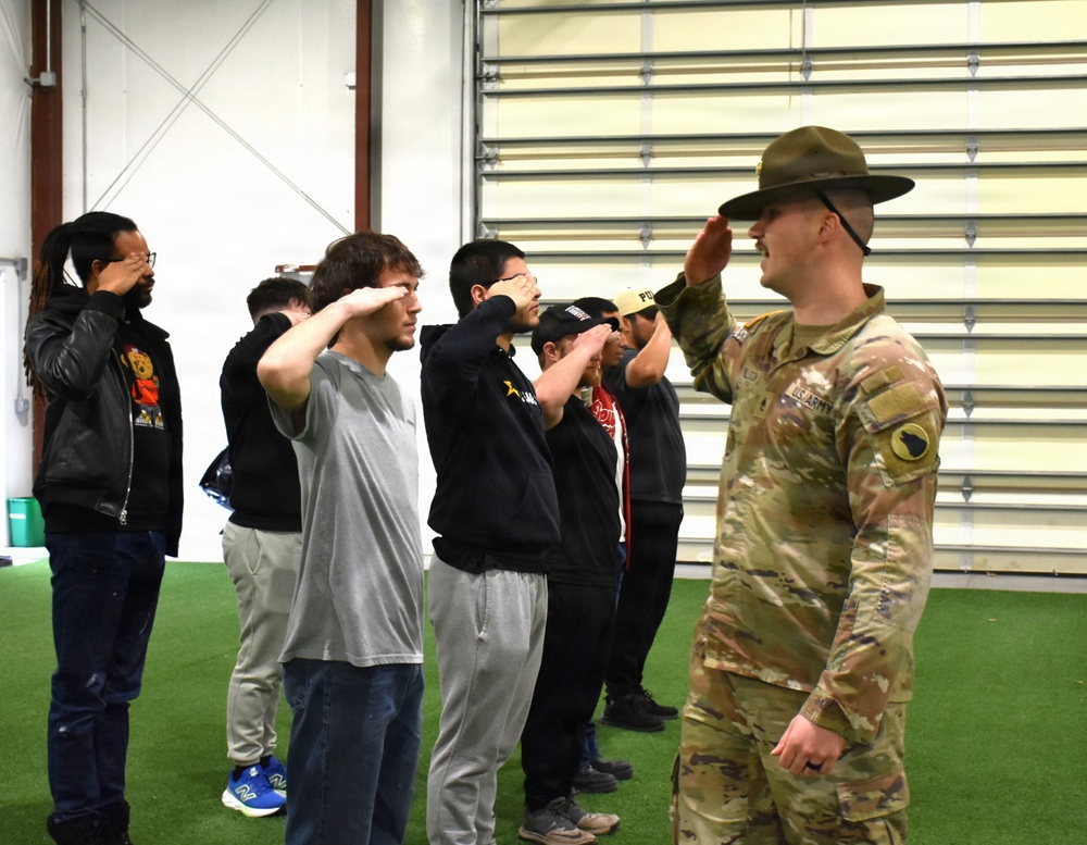 Drill Sgt. John Rollison demonstrates proper salute