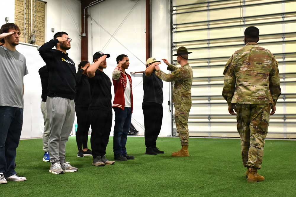 Drill Sgt. John Rollison reinforces drill techniques