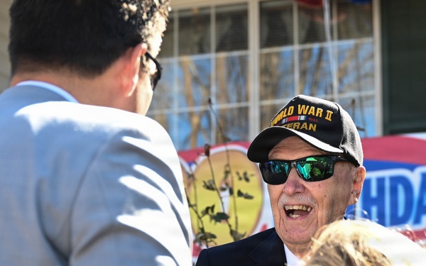 Centennial birthday parade honors WWII veteran