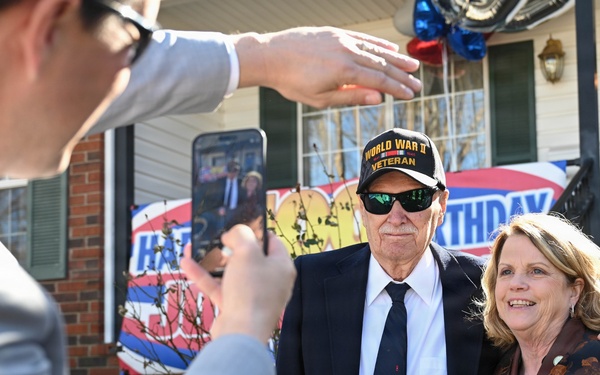 Centennial birthday parade honors WWII veteran